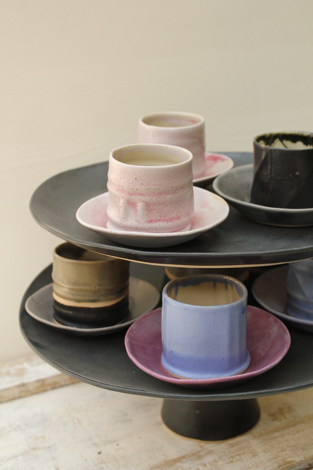 fun little cups and saucers for tea or coffee in pink purple grey and black