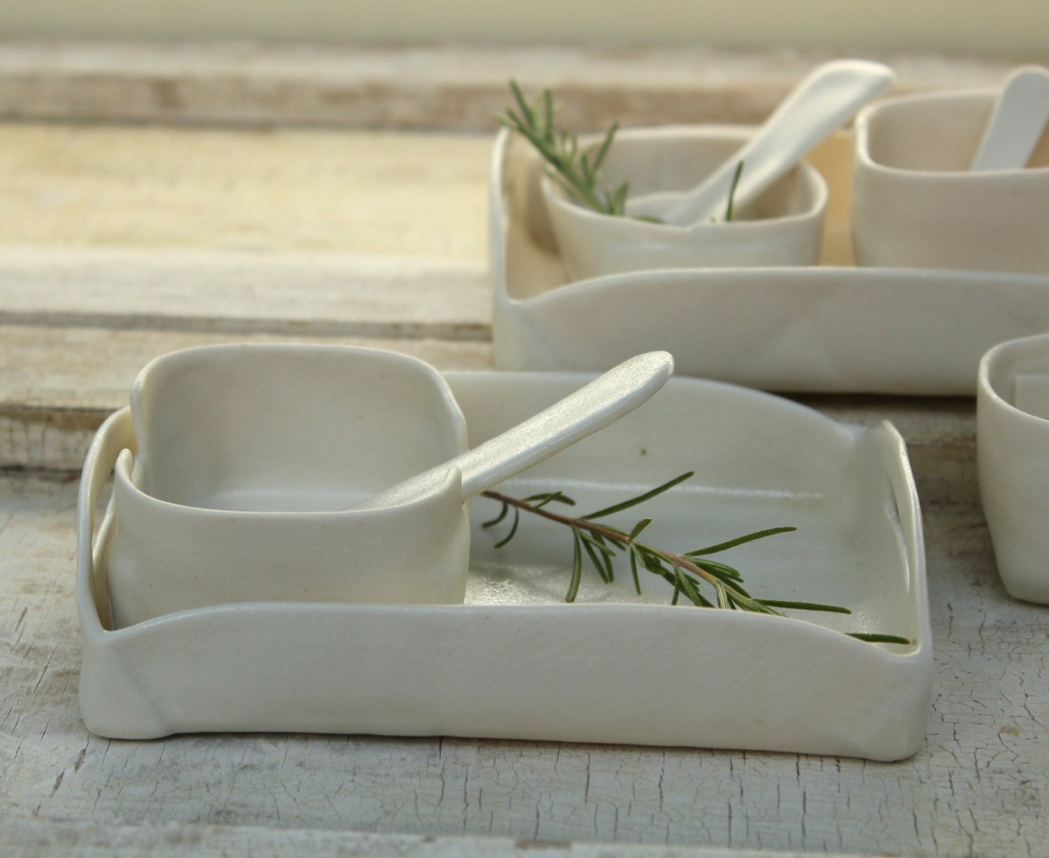 little porcelain tray with fun serving dishes and spoons for salt or pepper or mustard or home made mayonnaise o