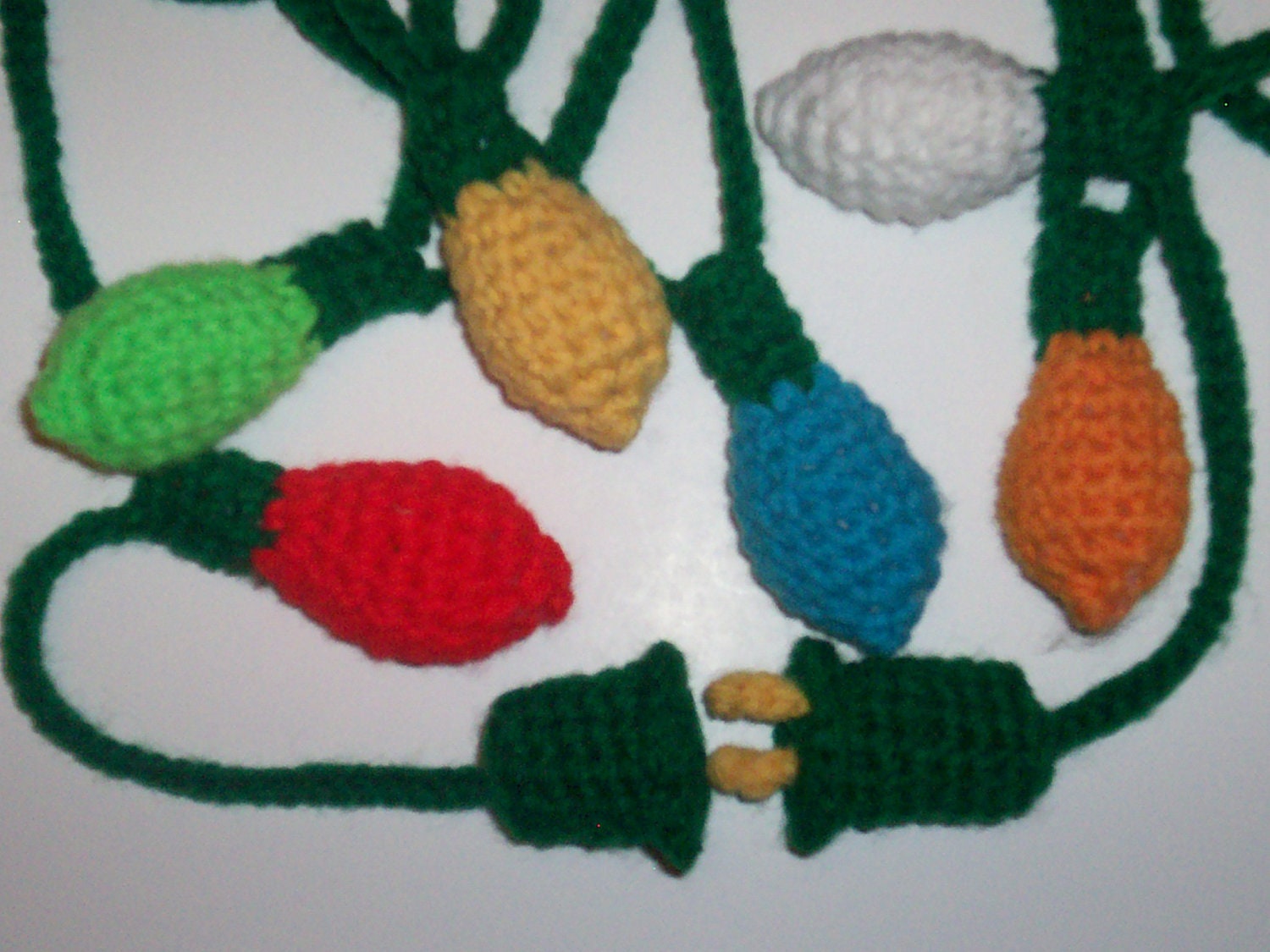 http://www.etsy.com/listing/116231883/crocheted-christmas-tree-light-garland?ref=market