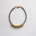 Simple Shining Bracelet . Dark Green - with golden brass and polished cotton cord