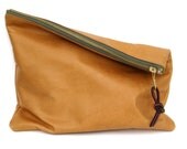 G E N T L E M A N / / /  The Traveler Clutch  // oversized leather clutch in camel with olive green zipper