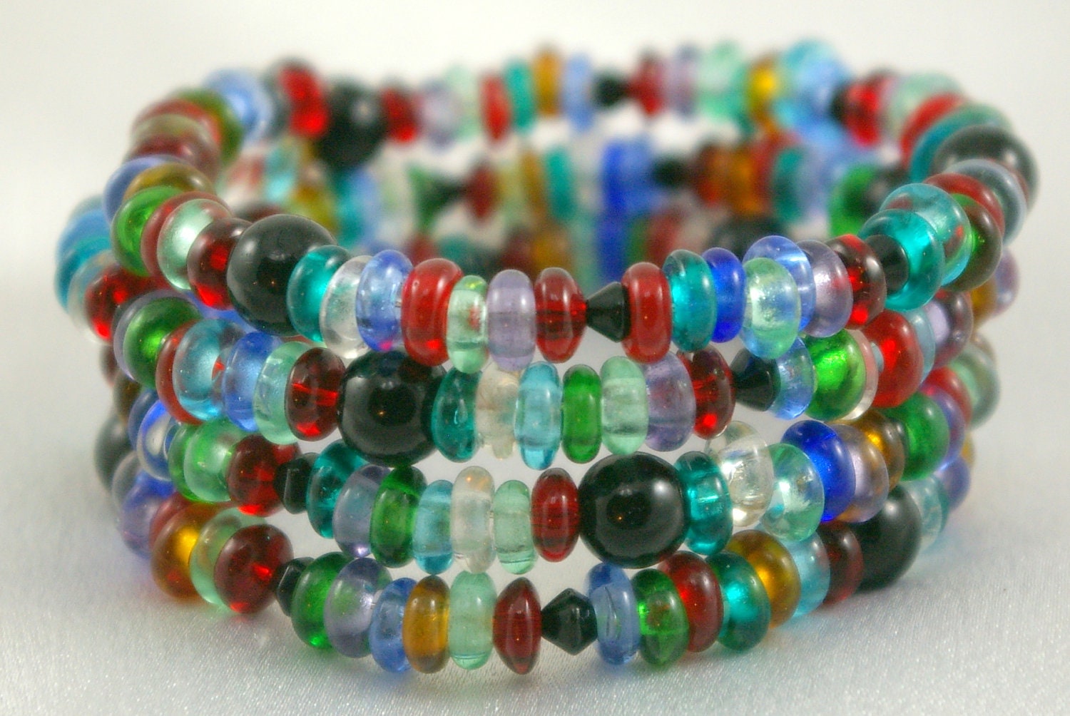 Bright lampwork Bracelet on Memory wire.  Happy.  Spiral.