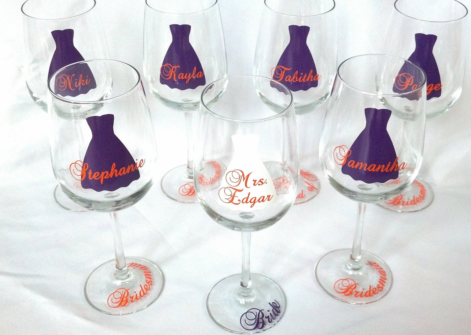 1 bridesmaid dress wine glasses, name over the dress, date and title on the base, your choice of colors