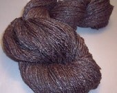 Handspun Merino wool and  hand dyed silk. 430 yards