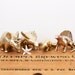 Reserved for Sue // vintage brass set of four dinosaur figurines
