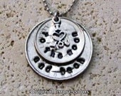 I love you to the moon and back coin jewelry necklace pendant with a sterling silver charm on a stainless steel chain.