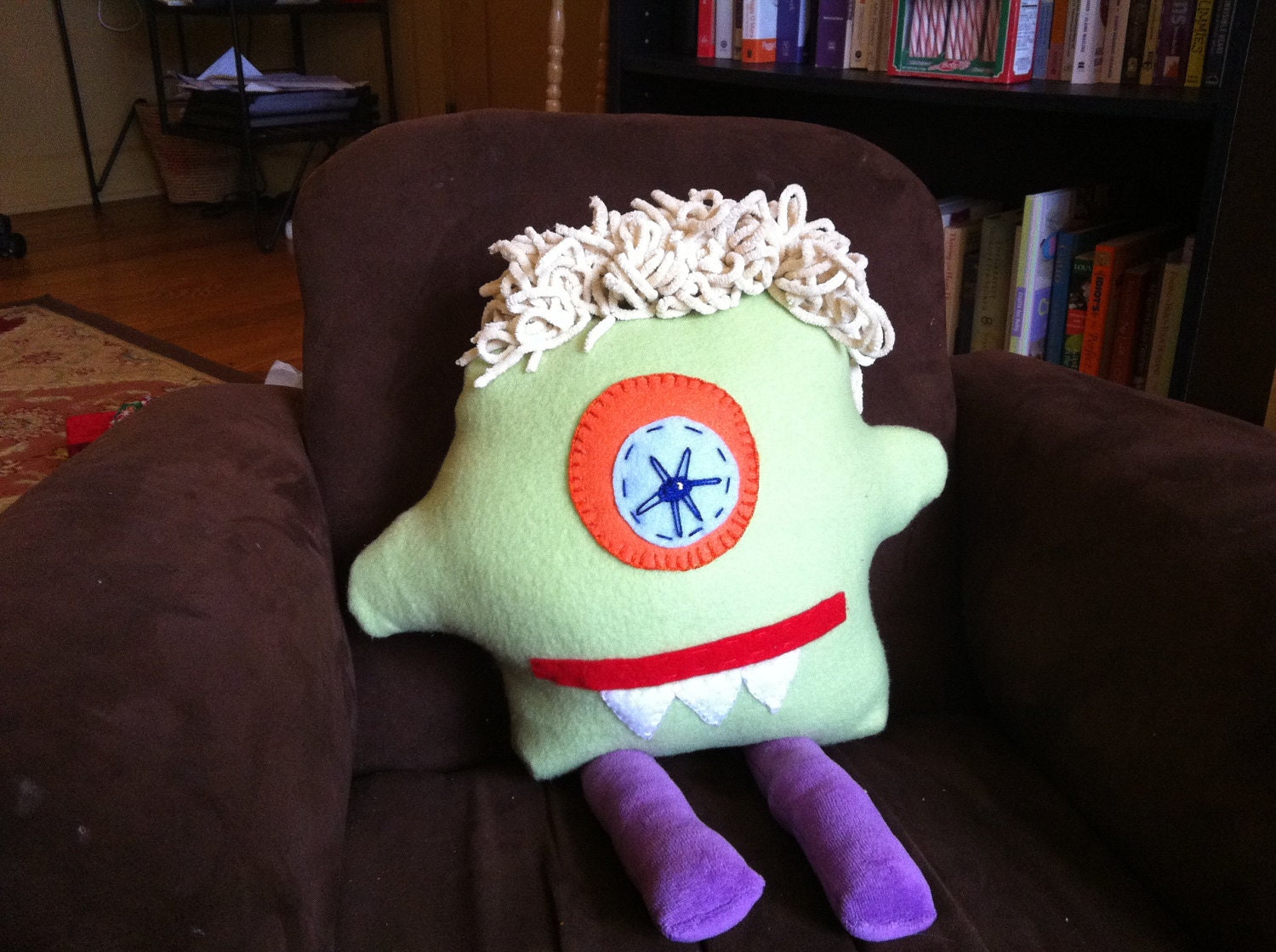 Plush Monster - One-eyed Cyclops monster in green fleece with purple legs and cream chenille hair.
