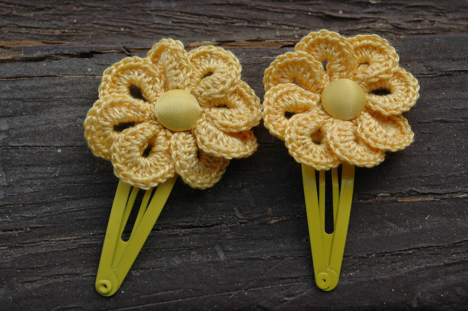 Set of two crocheted flower barrettes Yellow color