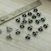 pkg of (20) - 8mm Silver Flower Drops