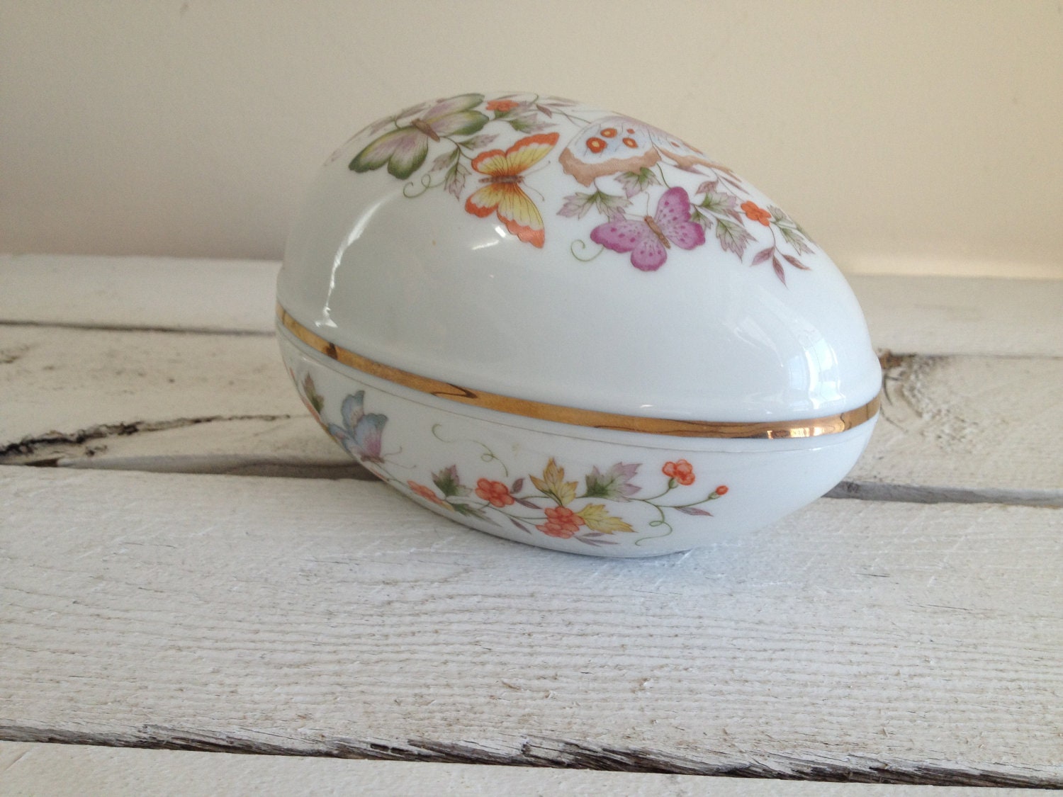 Vintage Avon egg with butterflies and floral pattern