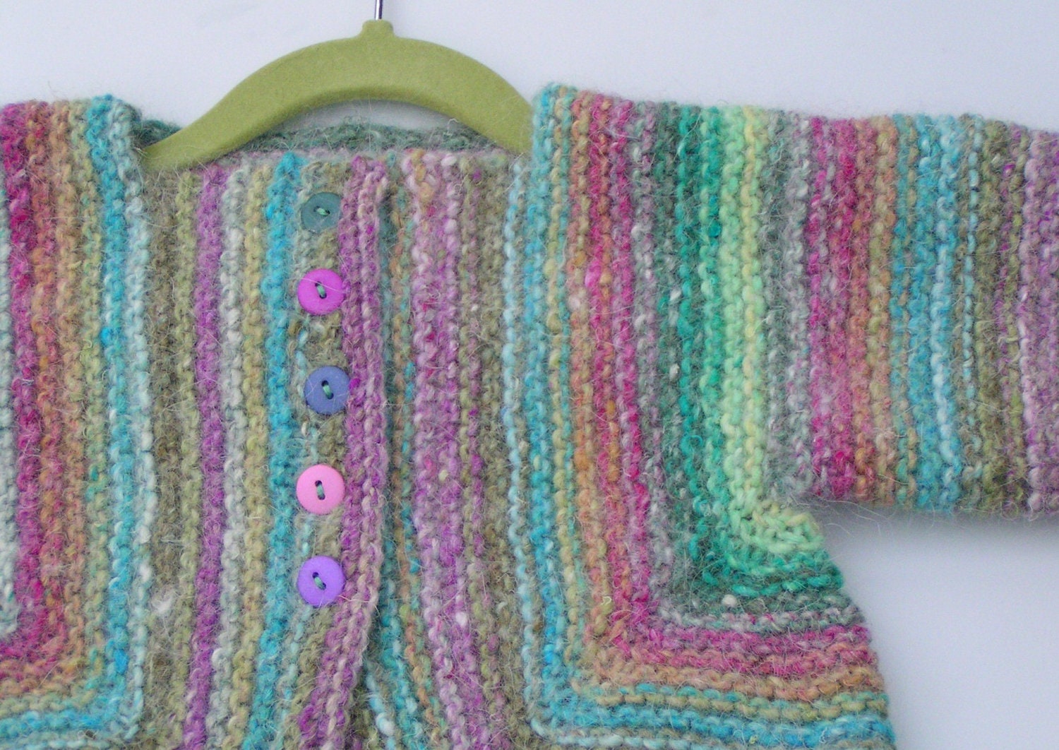Baby"s Surprise Jacket (BSJ) and cloche hat: knitted in Noro luxury yarn, for toddlers' aged 24 to 30 months