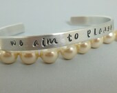 Fifty Shades of Grey inspired hand stamped bracelet - We aim to please