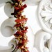 Woven spiral rope bracelet featuring goldstone chips and a magnetic clasp
