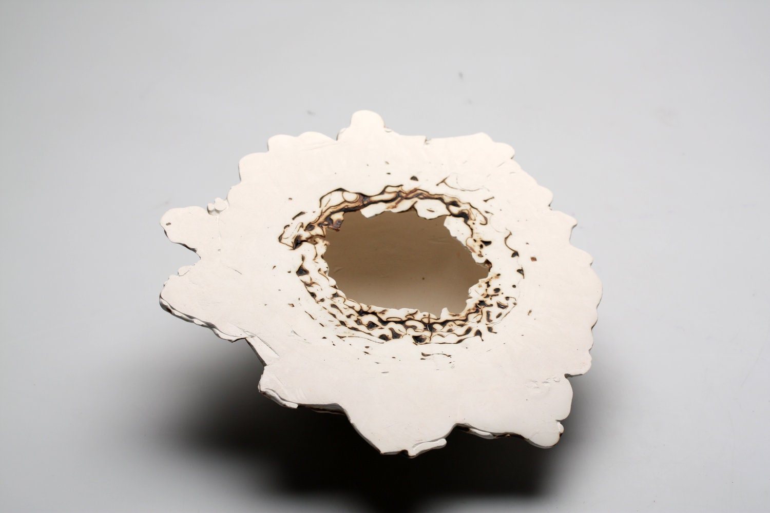Earthenware vessel with white stoneware clay and copper oxide.