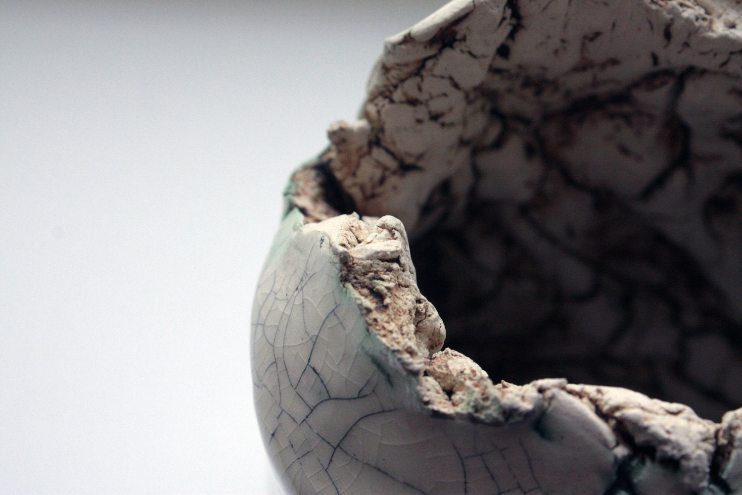Handbuilt bottle shape pot with aged craking glaze
