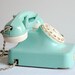 Aqua mint green vintage rotary telephone.