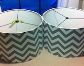 Pair of  Drum Lamp Shades  in  a great grey / silver chevron print , lampshades are both 14"X 10"