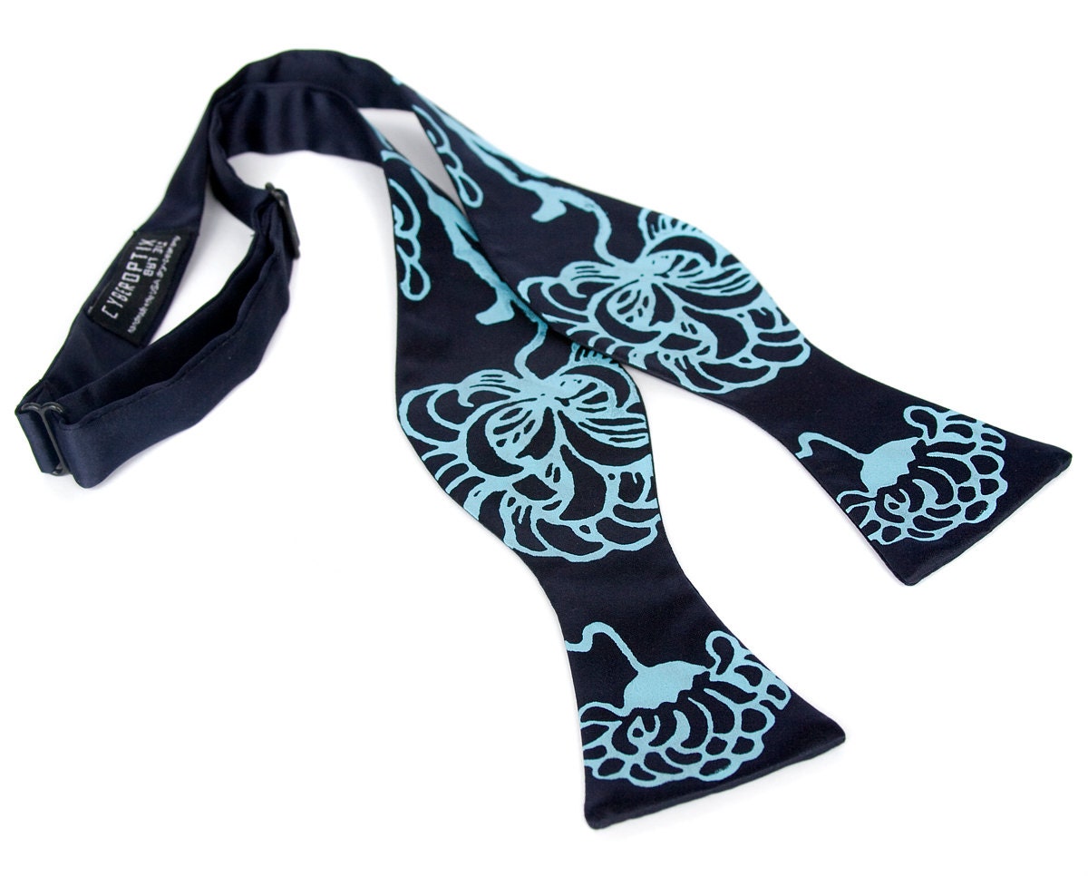 Chrysanthemum bow tie. Turquoise and navy blue freestyle tie. Self-tie. Silkscreened floral necktie.