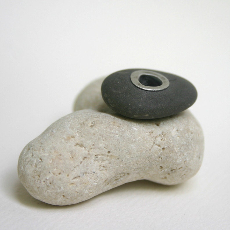 Silver Riveted Beach Stone . Grey Stone With Big Silver Rivet . Exhibit B