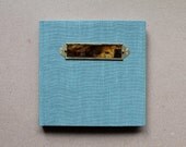 Turquoise Linen Journal with a Collaged Label