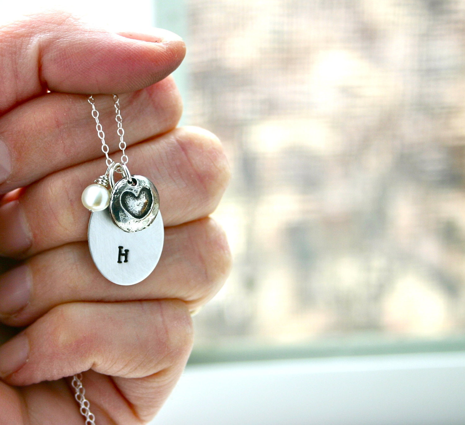 Personalized initial necklace - Oval charm accented by heart and pearl