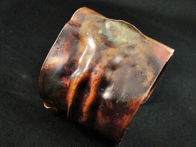 Wide copper cuff.  Multi color heat patina.  Fold forming.  The Pinch
