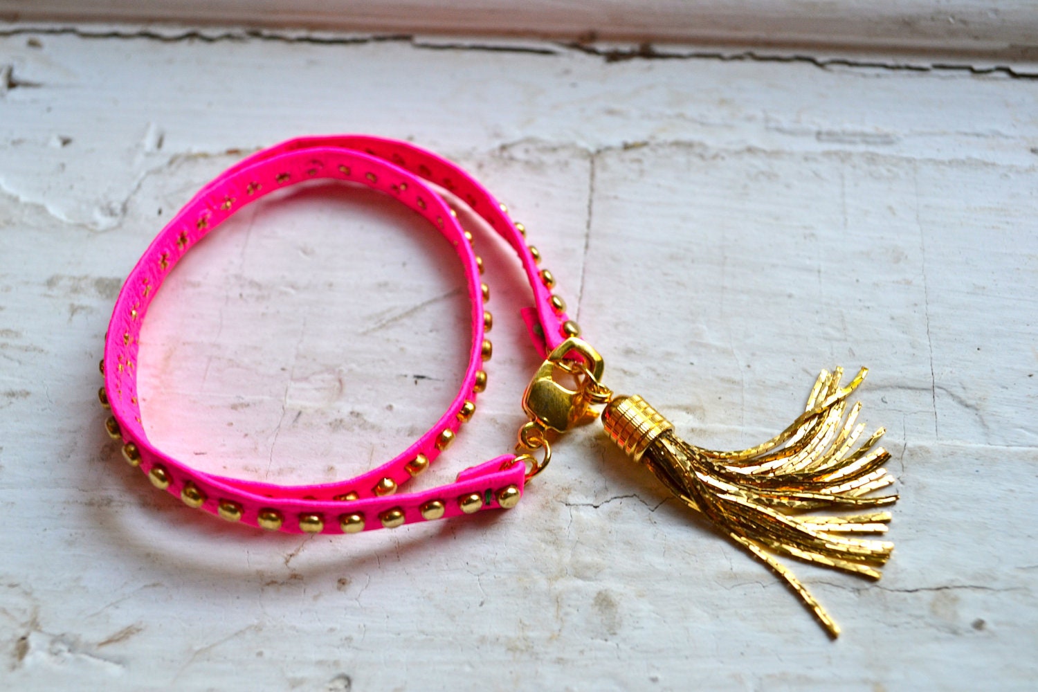 studded pink neon genuine leather & gold double wrap bracelet with gold tassel
