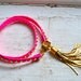 studded pink neon genuine leather & gold double wrap bracelet with gold tassel