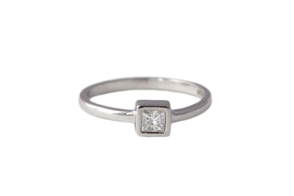 Princess Cut Diamond Solitaire Ring. Silver and White diamond.
