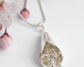 Beautiful organic sterling silver kinetic pendant