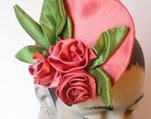 Coral Satin Rose Fascinator with moss green leaves