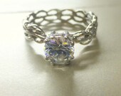 Unique engagement ring. Modern design. 14k gold white sapphire center.