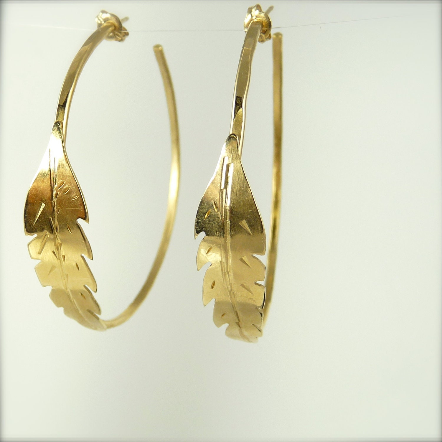 Gold Feather Hoops, hammered hoops, large feather hoops, designer, artisan, tribal, native, unique hoops