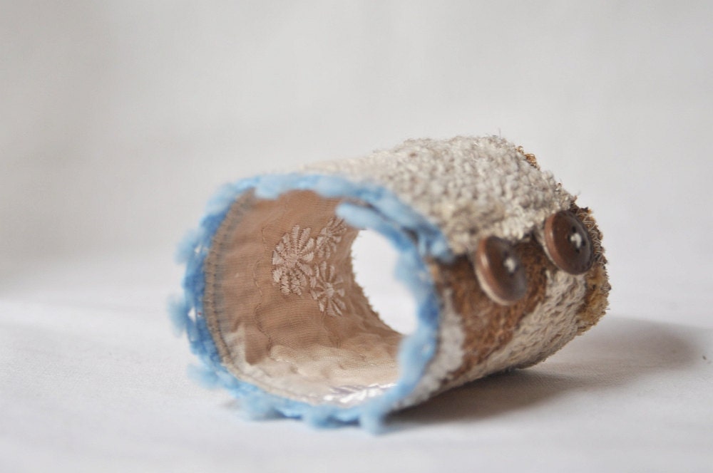 Upcycled asymmetrical beige blue cuff made of recycled sweaters. Decorated with vintage cotton lace. Upcycled accessories Eco friendly