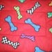 Reversible Medium Fleece Crate Mat Red with Multi Colored Bones