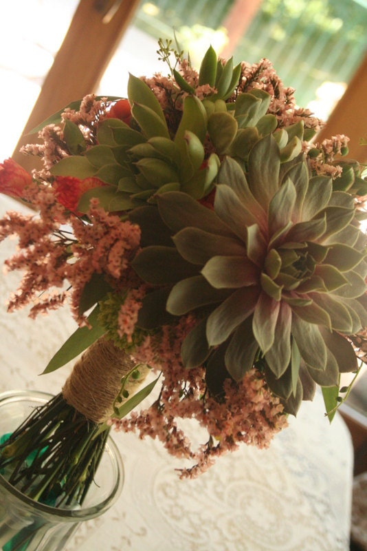 Bouquet, succulents and floral accents. Wrapped in burlap twine. Rustic, country, organically inspired.