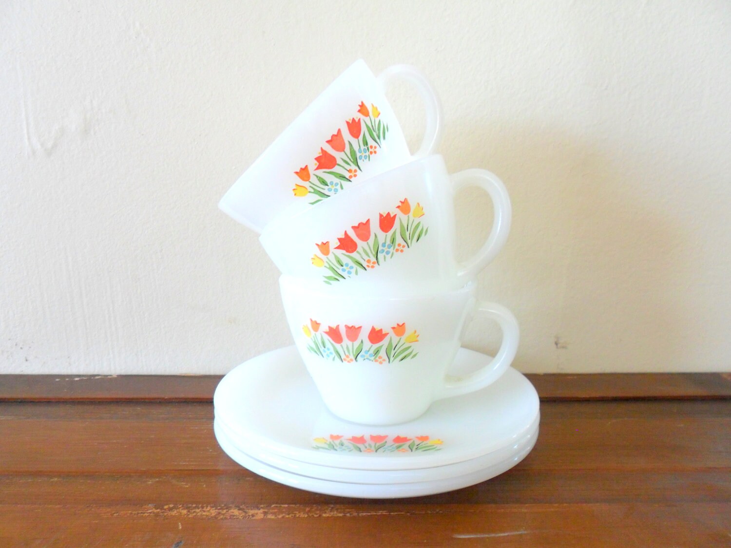 set of three vintage tulip detailed fire king tea cups with saucers - floral - milk glass