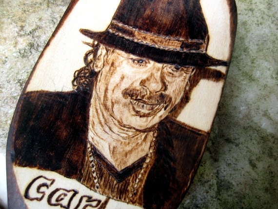 Carlos Santana and his guitar -pyrography art portrait
