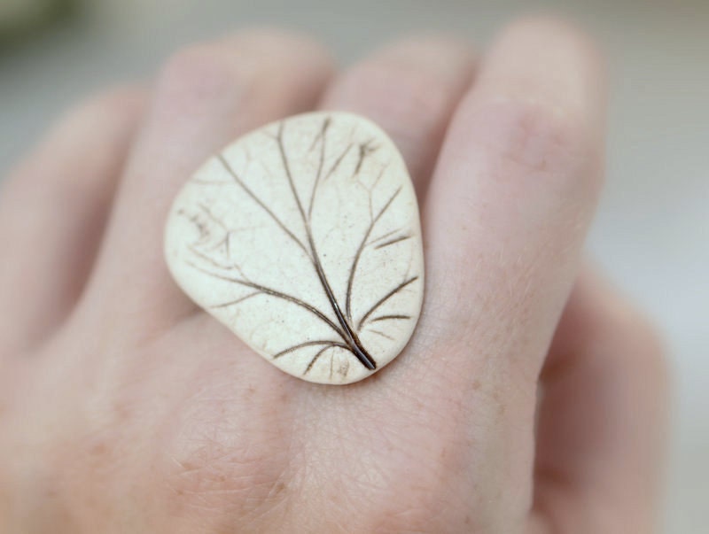 Reveal - An earthy porcelain ring with impression of a Coral Bell leaf.