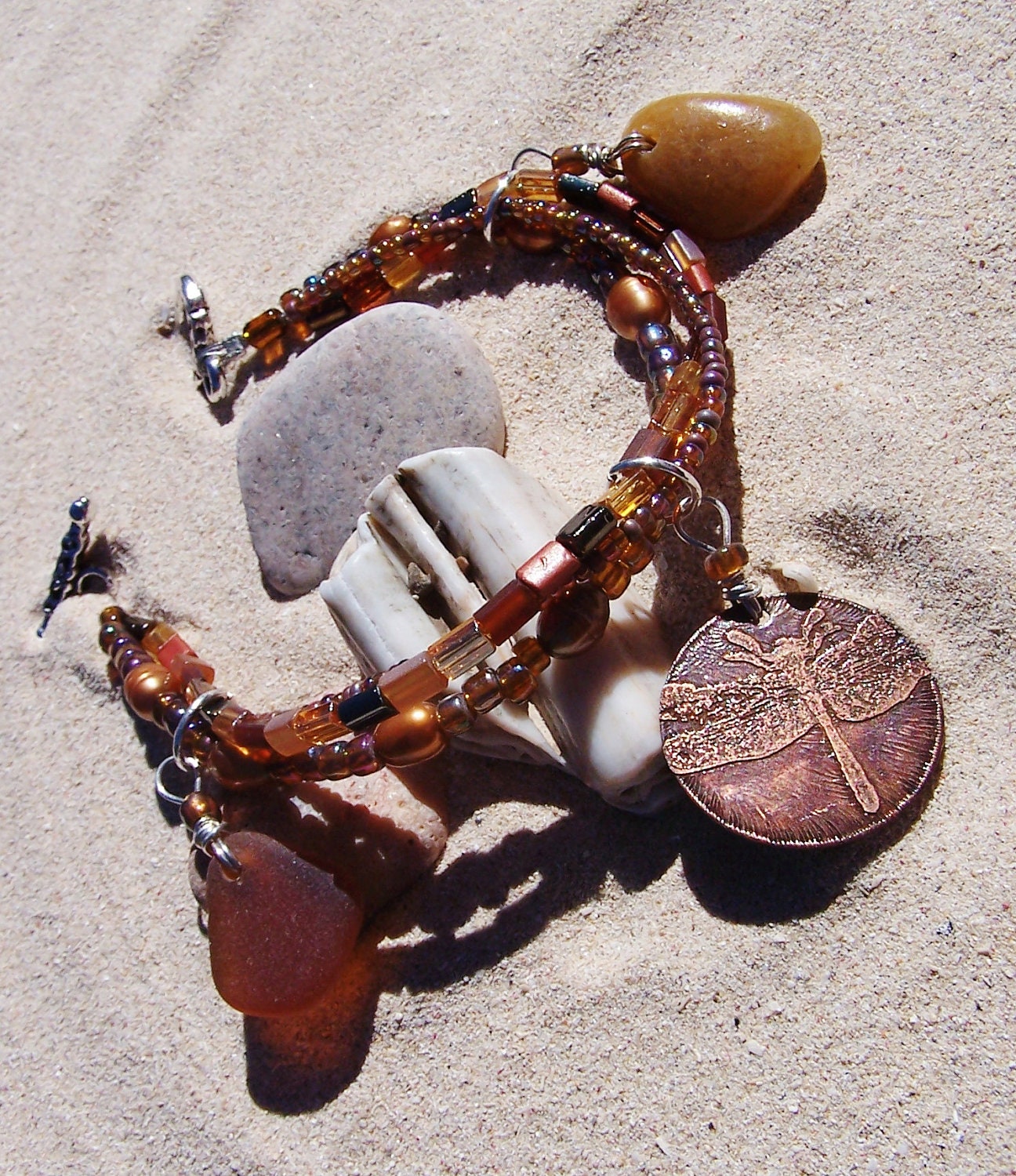 Beaded Sea Glass Charm Bracelet in Brown and Amber with Copper Dragonfly