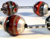 Rivetting Black Grey White Superman Red Bracelet
