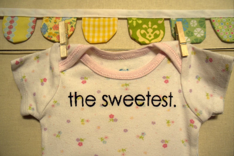 the sweetest --- white patterned onesie, size newborn