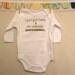 I just got here & I'm already awesome.  --- white long-sleeved onesie, size 0-3 months.