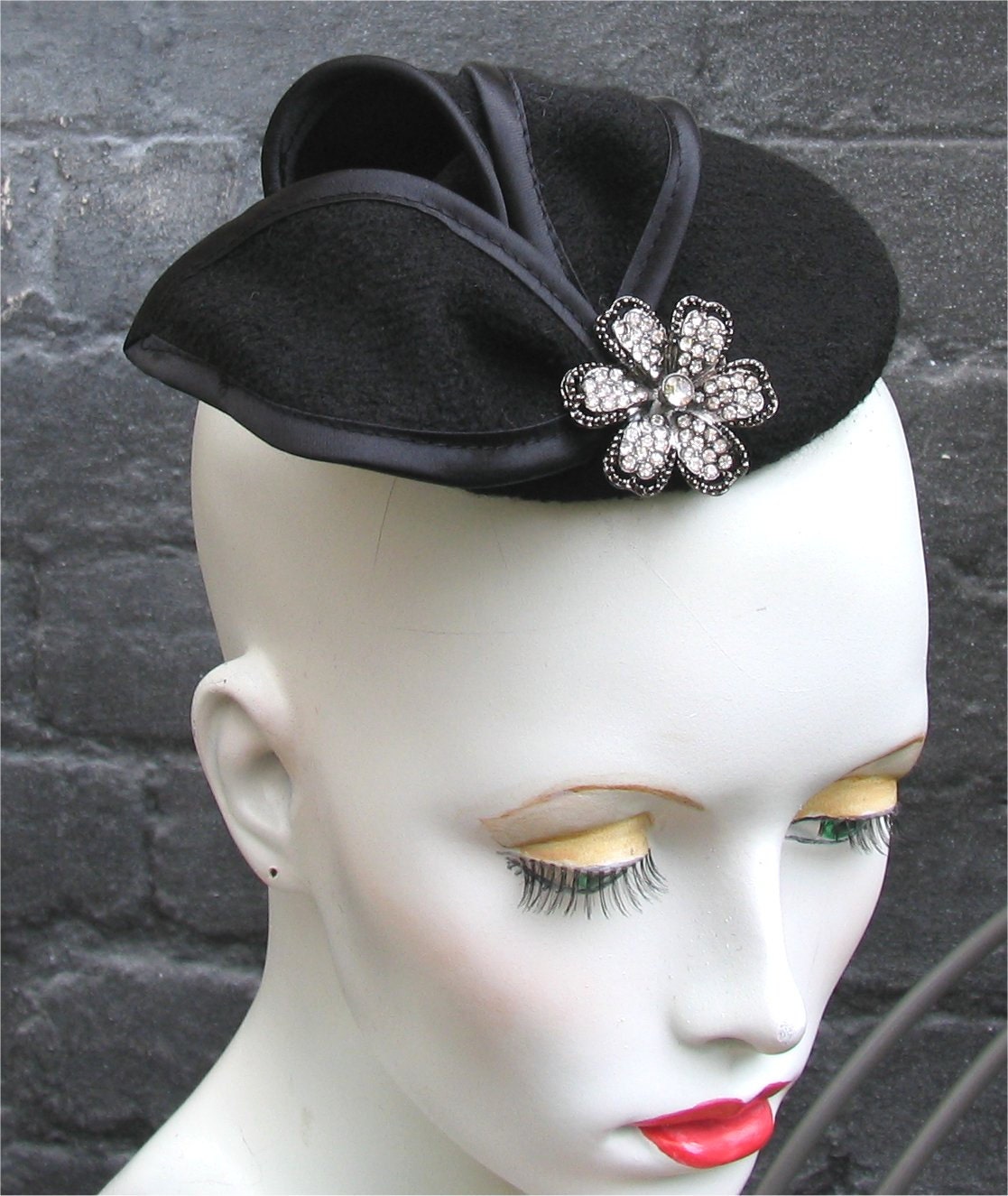 Black cocktail fascinator hat with diamonte flower