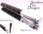 Zen  rollerball pen with magnetic cap in chrome  and  hand cast black and silver and gold braid.