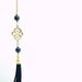 Matte Gold Plated Oriental Infinity Charm Lariat Necklace with Navy blue Lapis Lazuli Stones and Suede Leather Tassel