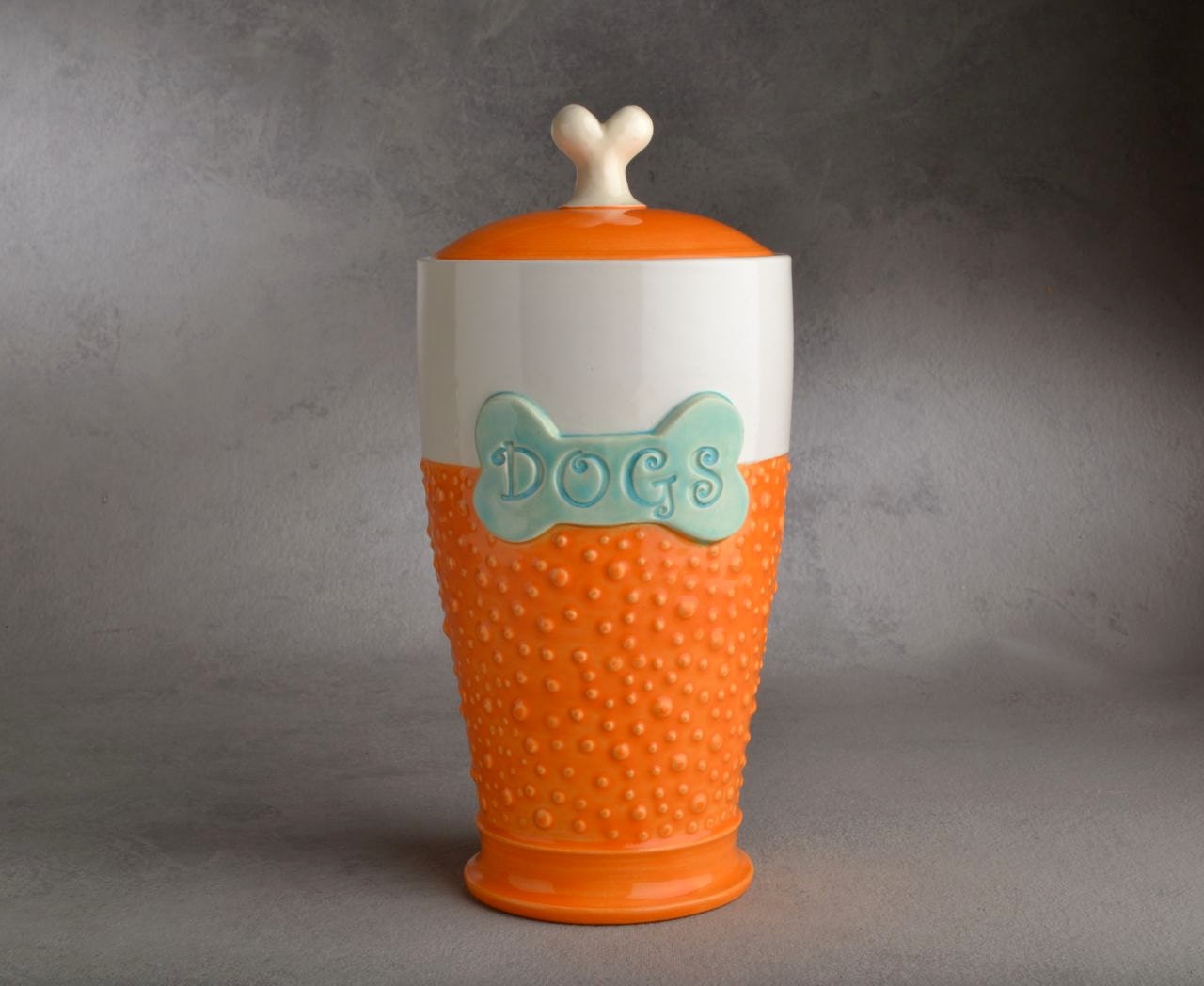 Dog Treat Jar: "Dogs" Orange and White Dottie Dog Treat Jar by Symmetrical Pottery