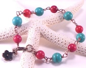 A Red Coral and Turquoise Magnesite Bracelet.  Wire Wrapped.