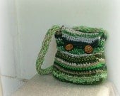 Crocheted bag forest green long strap with wooden buttons