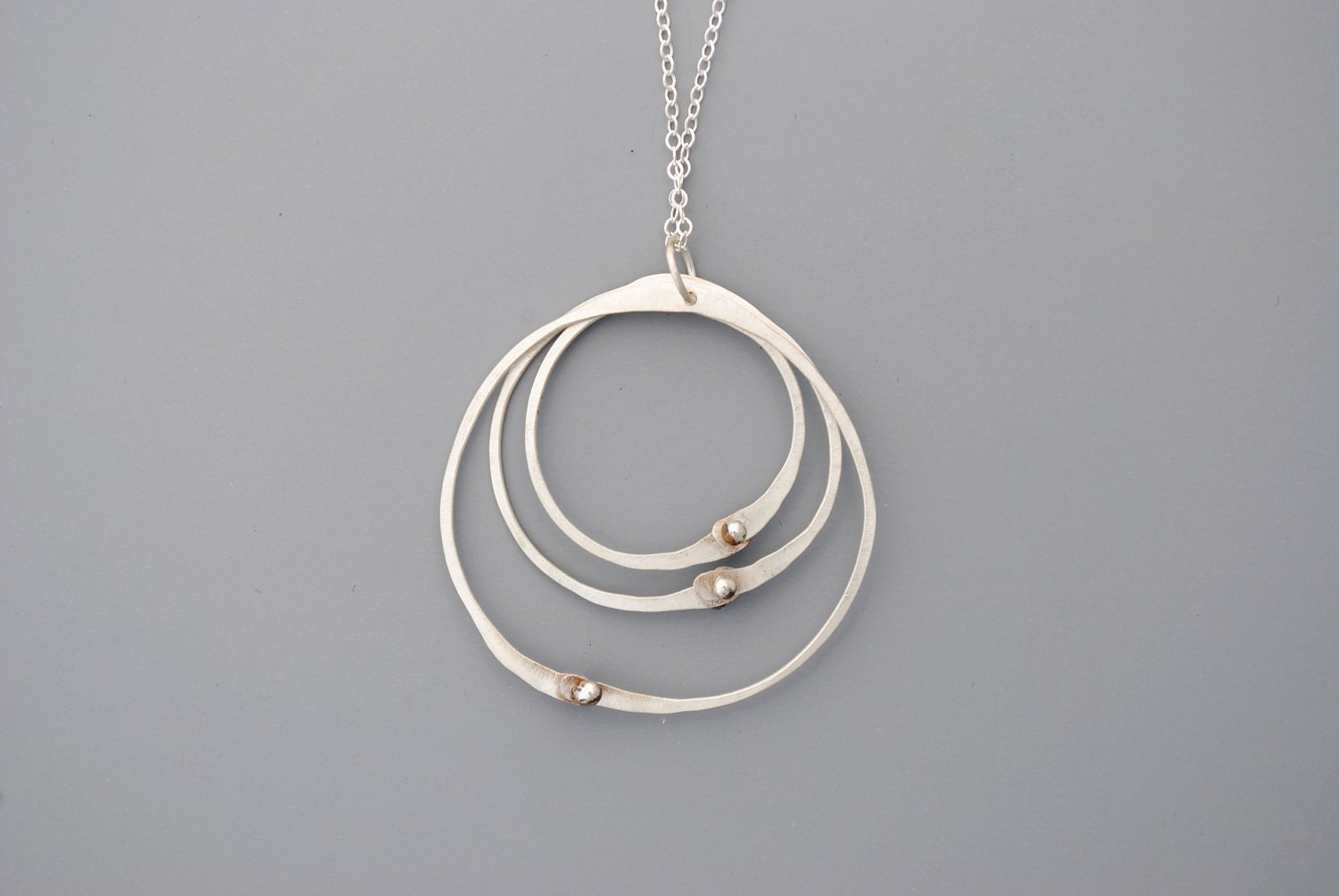 Handmade jewelry. Sterling silver three circles necklace.